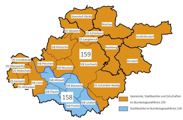 Auf dem Bild sieht man eine Karte der Stadt Dresden und angrenzender Gemeinden im Nordosten Dresdens. Das Gebiet ist in die Wahlkreise 158 (Süden und Südosten, blau markiert) und 159 (Südwesten, Norden und nördliche Gemeinden, orange markiert) aufgeteilt.