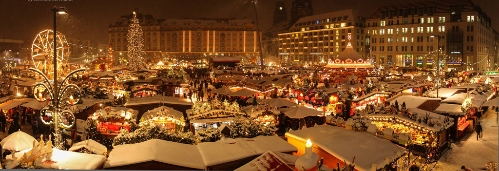 Dresden Striezelmarkt with snow and lights everywhere.